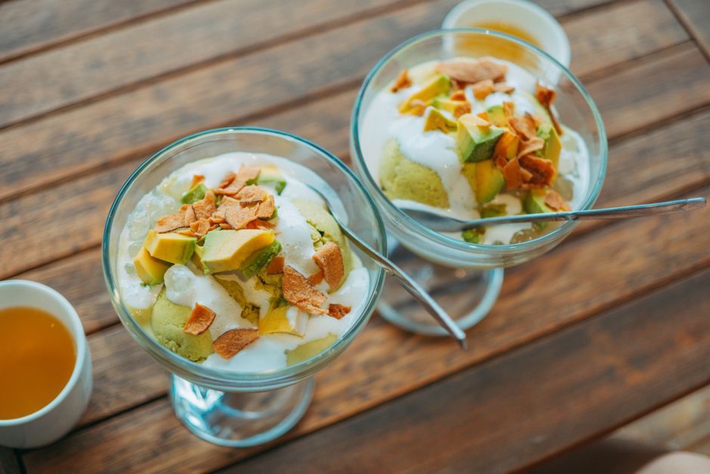 a spread of hydrating paleo-friendly foods including avocado coconut water and broth