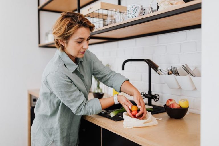 Chopping fresh vegetables for an AIP-friendly dinner prep