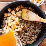 A colorful skillet breakfast with turkey and sweet potato