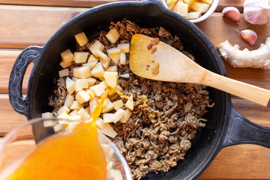 A colorful skillet breakfast with turkey and sweet potato