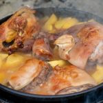Tender chicken and vegetables simmering in a pot