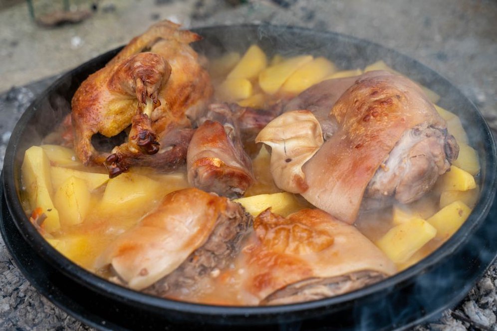 Tender chicken and vegetables simmering in a pot
