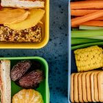 Packed snack box with chicken, fruit, and vegetables