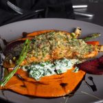 Salmon and sweet potato served with cooked vegetables