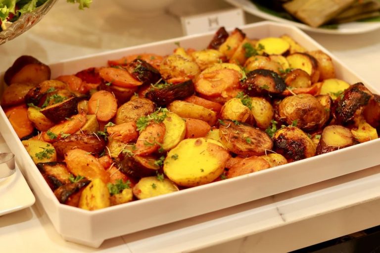 A varied bowl of cooked vegetables and roots