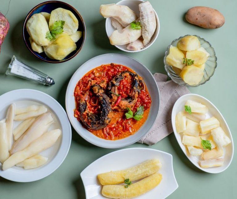 A table with colorful whole-food dishes from several traditions