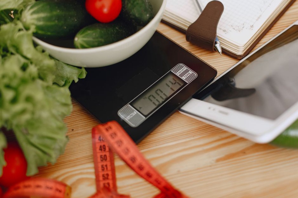 A simple food journal beside a nourishing meal