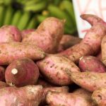 Vegetables and dinner ingredients arranged beside a shopping list