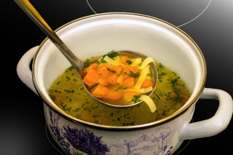 A warm mug of clear homemade broth