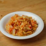 Small bowls of fermented foods beside a Paleo meal
