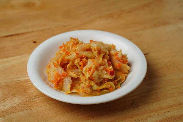 Small bowls of fermented foods beside a Paleo meal