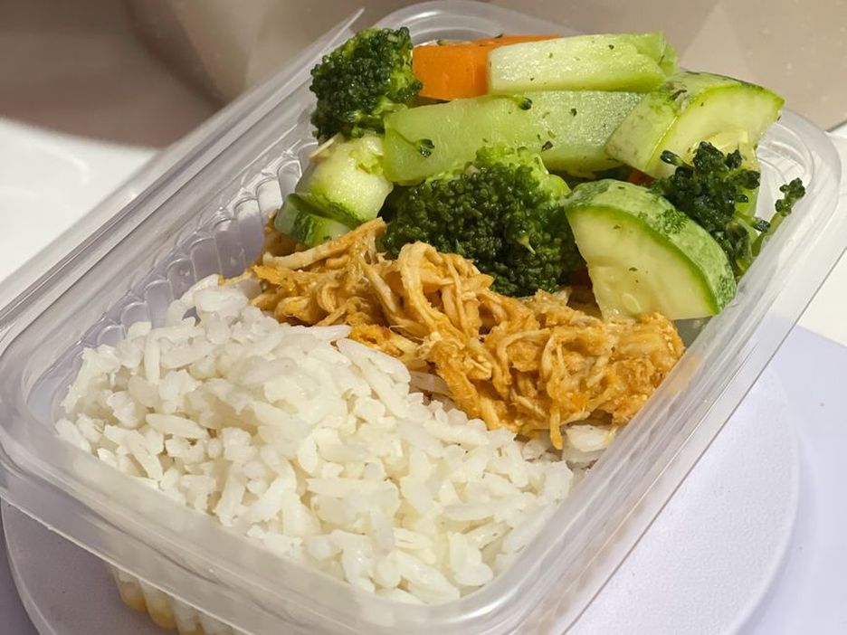 Separate containers keep cooked meal components ready to combine