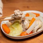 A seated lunch with cooked vegetables and chicken