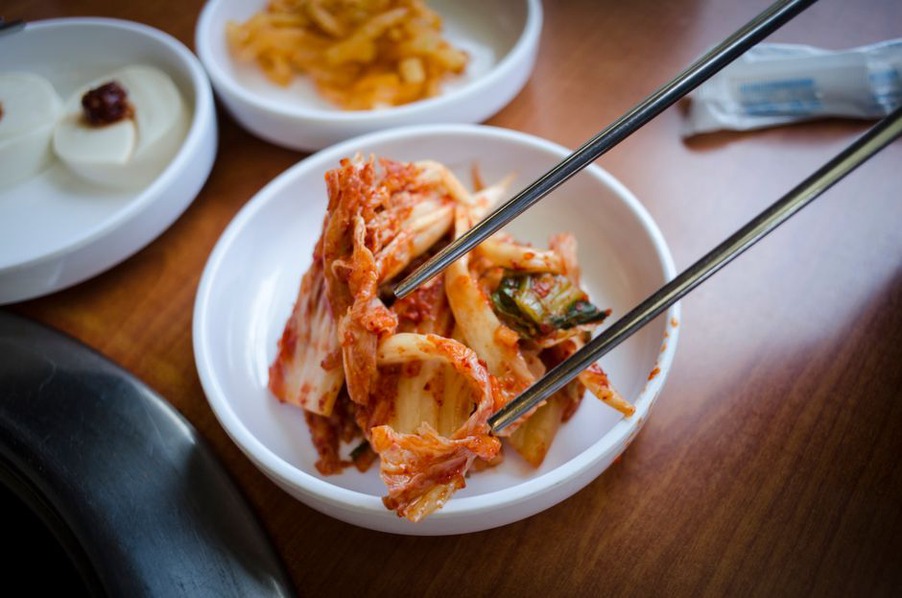A person eating a meal rich in fermented foods