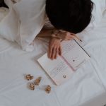 A notebook tracks meals and symptoms