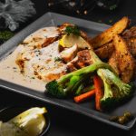 Chicken and cooked vegetables served for dinner