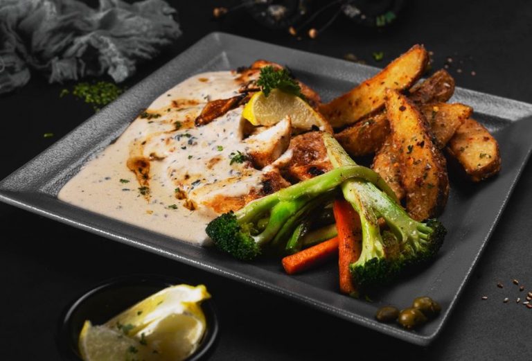 Chicken and cooked vegetables served for dinner