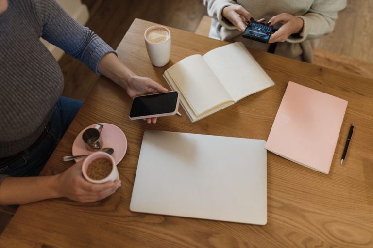 Two people compare dinner plans at the table
