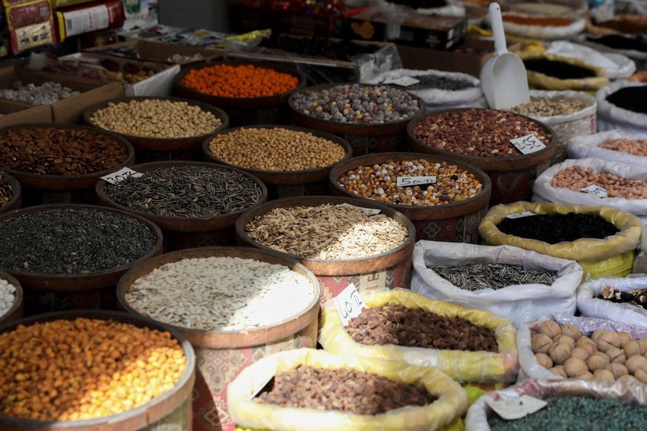 A selection of walnuts and flaxseeds in bowls