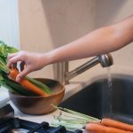 Carrots and greens washed before chopping