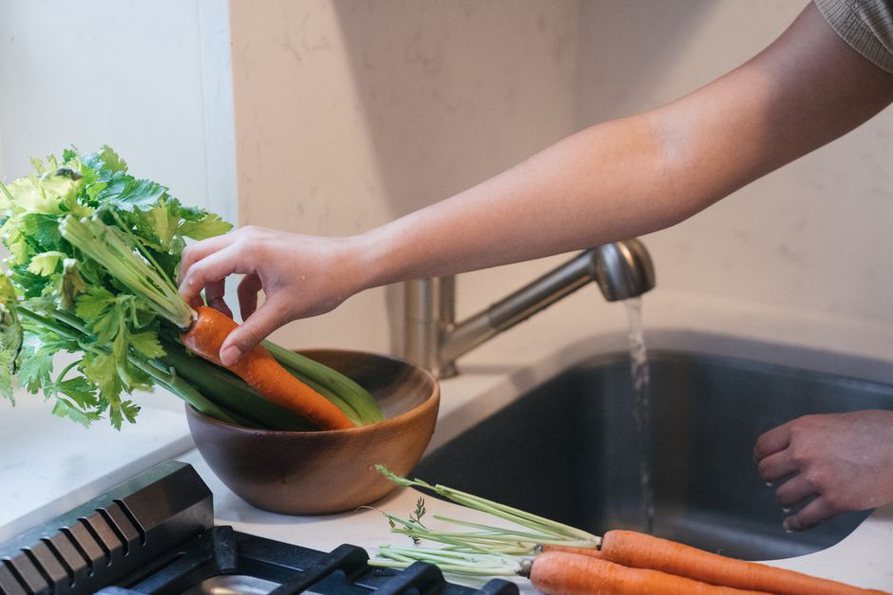 Carrots and greens washed before chopping