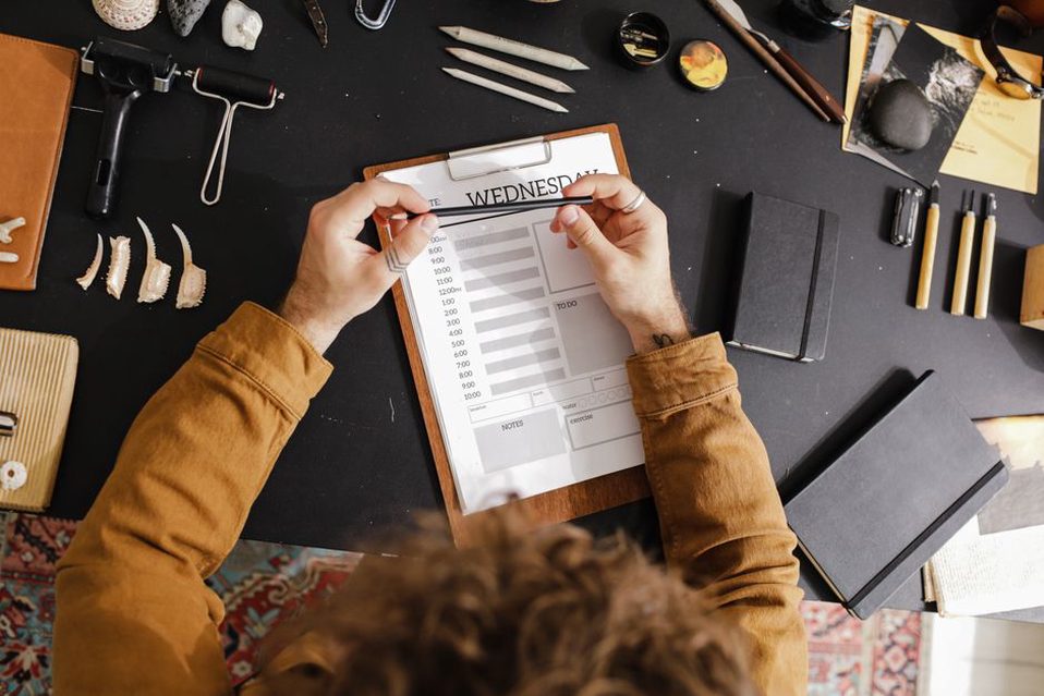 A short shopping list beside planned meals