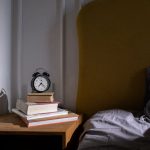 Morning light reaches a bedside clock