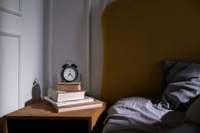 Morning light reaches a bedside clock