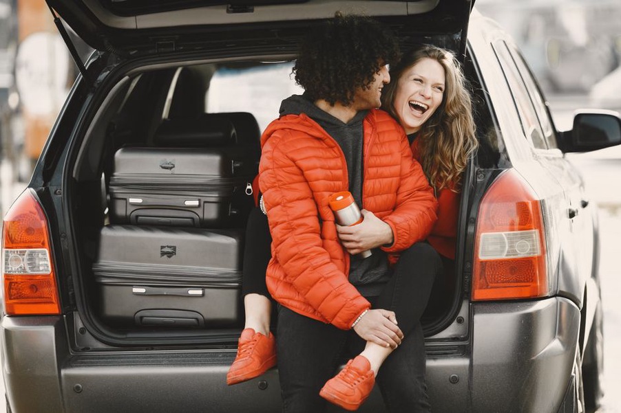 Weekend bags and a cooler secured for travel