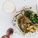Chicken lunch with potatoes and colorful vegetables