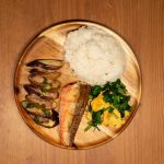 Fish and cooked vegetables served for dinner