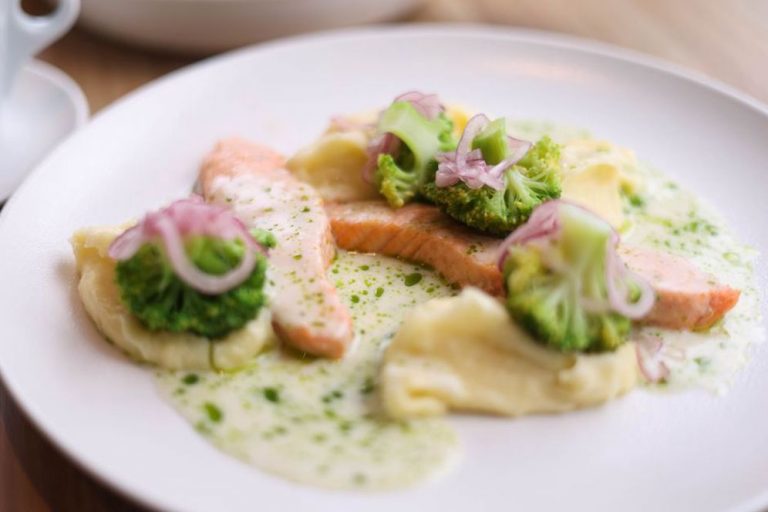 Salmon and cooked vegetables served with sweet potato