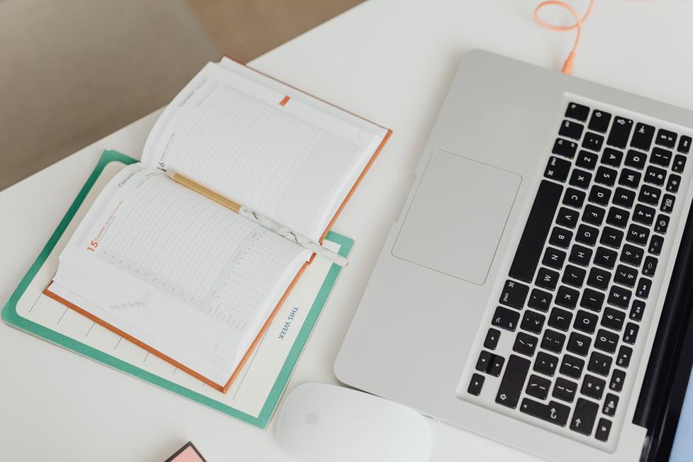 A notebook tracks planned posts and recipe tests