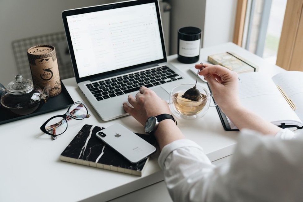 Draft email beside a marked publishing calendar