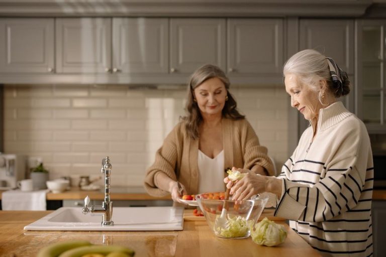 Two people preparing a shared meal