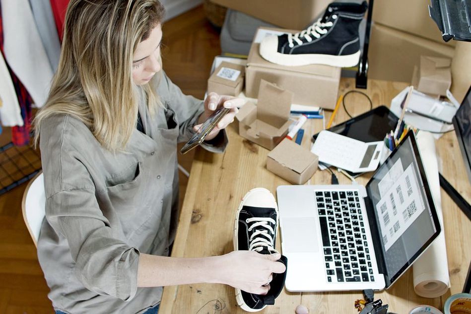 Shop owner reviewing hours and contact information