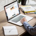 Notes comparing nutrition blog topics on a laptop