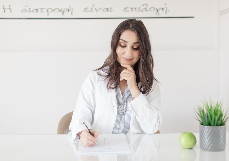 Notes and a calendar beside a meal plan