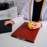 Practitioner reviewing notes before a client session