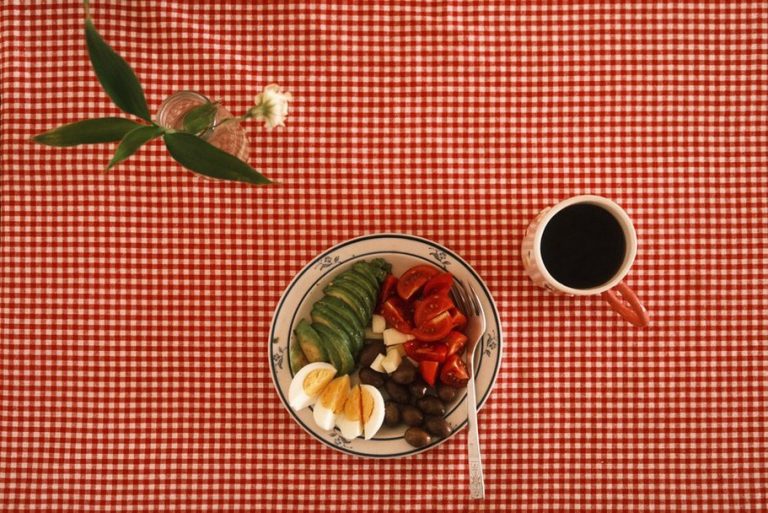 Ingredients arranged beside a home-cooked meal