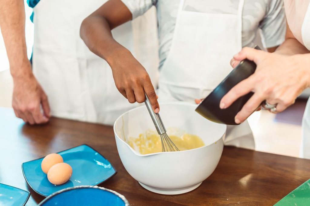 Baking ingredients laid out beside a printed recipe