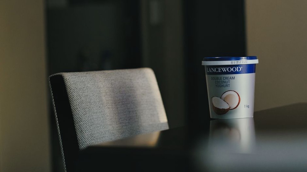 Coconut snack beside its ingredient label