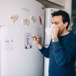 A short cleaning plan attached to the fridge
