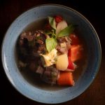 Tender beef and vegetables in a rich cooking broth