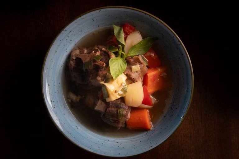 Tender beef and vegetables in a rich cooking broth