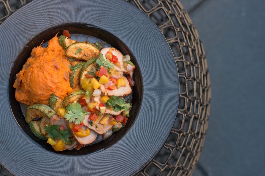 Chicken and sweet potato served with vegetables