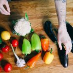 Tomatoes, peppers, and eggplant beside other vegetables