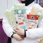 Plant-based drinks beside a breakfast bowl