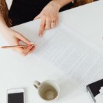 Interview notes beside a draft customer story
